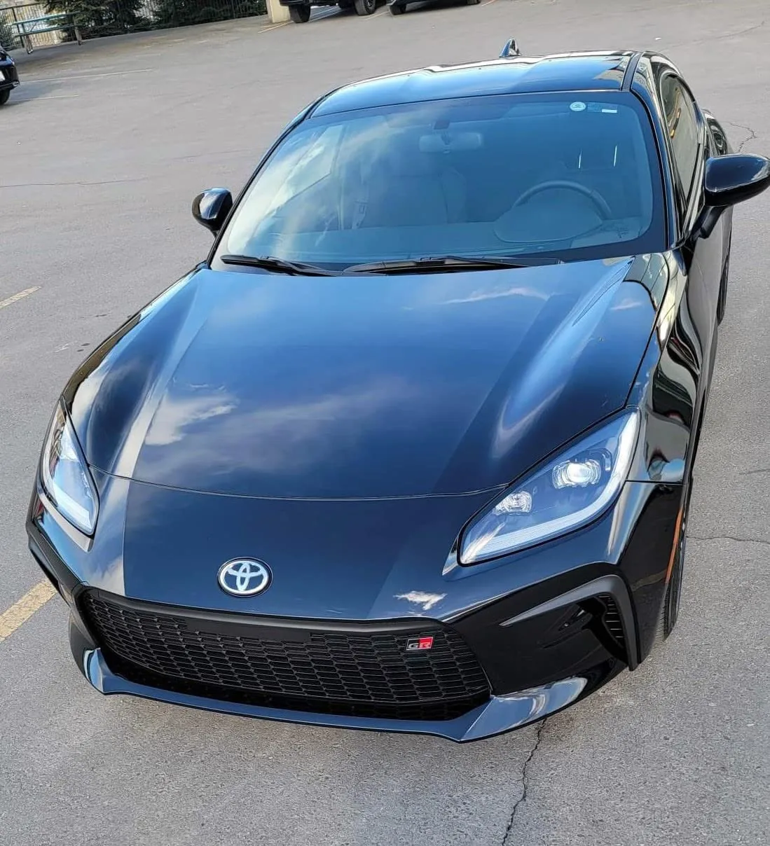 Glossy black Toyota GR86 with visible Toyota and GR badges