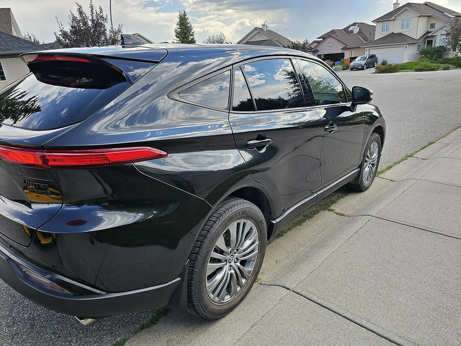 Glossy black Toyota Venza with visible Toyota badging